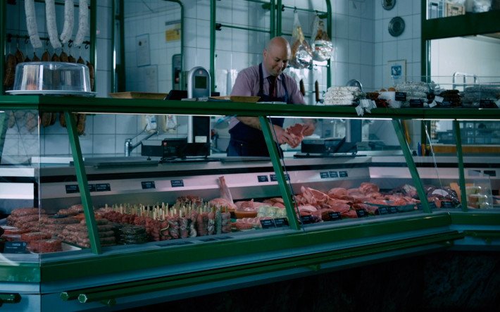 man working at meat store