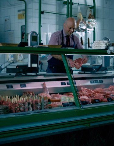 man working at meat store